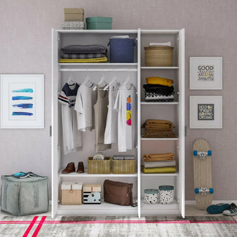 Organized open closet with clothes, boxes, and baskets for home storage, next to framed art and a skateboard in a cozy room.